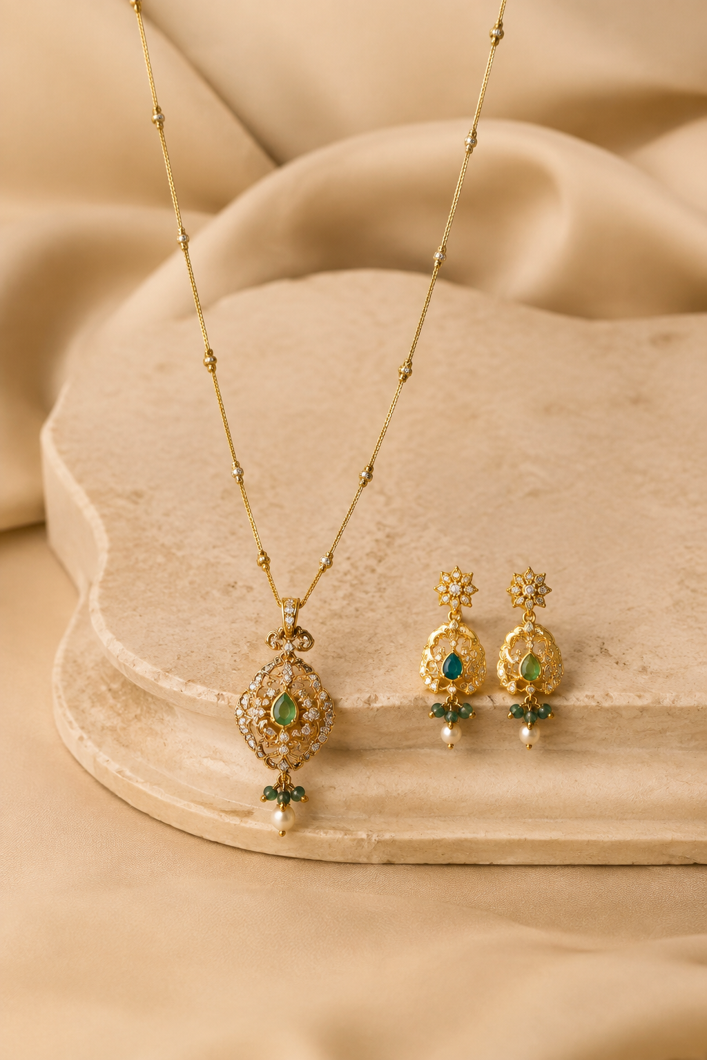 Delicate Meher gold pendant and earrings